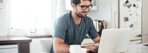 Man typing on a laptop