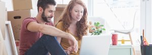 Couple sitting at a laptop