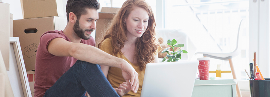 Couple sitting at a laptop