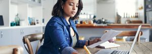 Woman writing at her desk