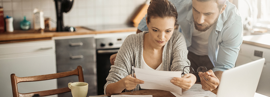 A couple looking at a piece of paper