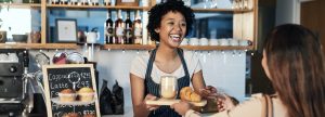 Young woman working as a barista