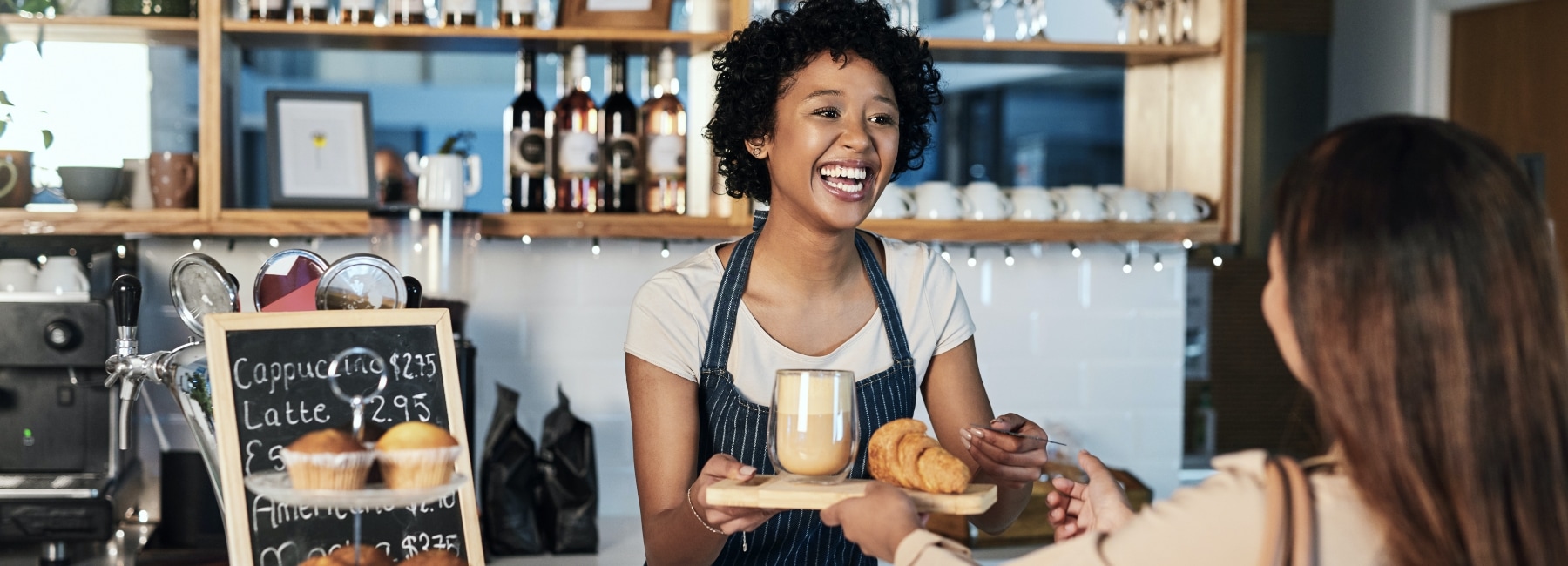 Young woman working as a barista