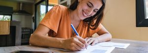Young woman filling out W-4