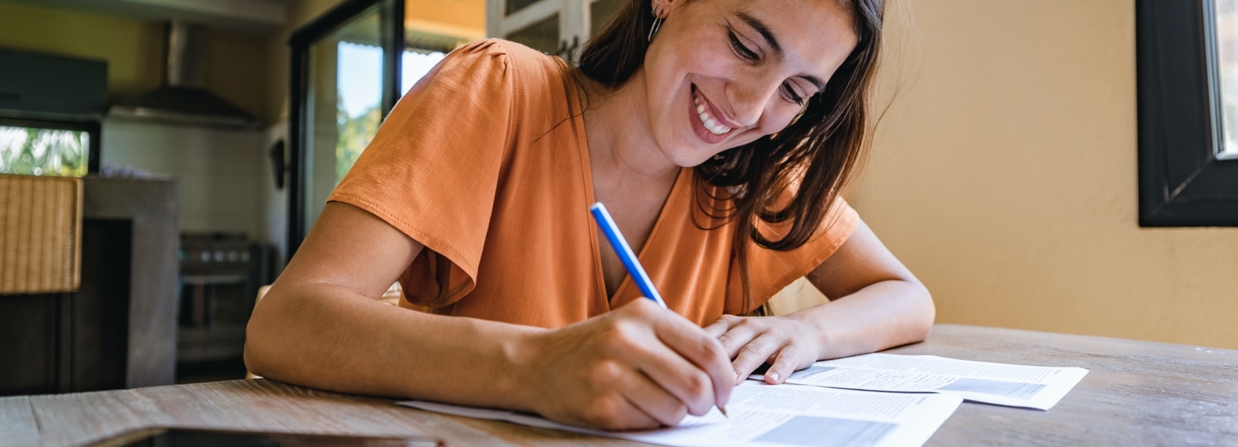 Young woman filling out W-4
