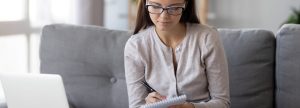 Young woman making a check list