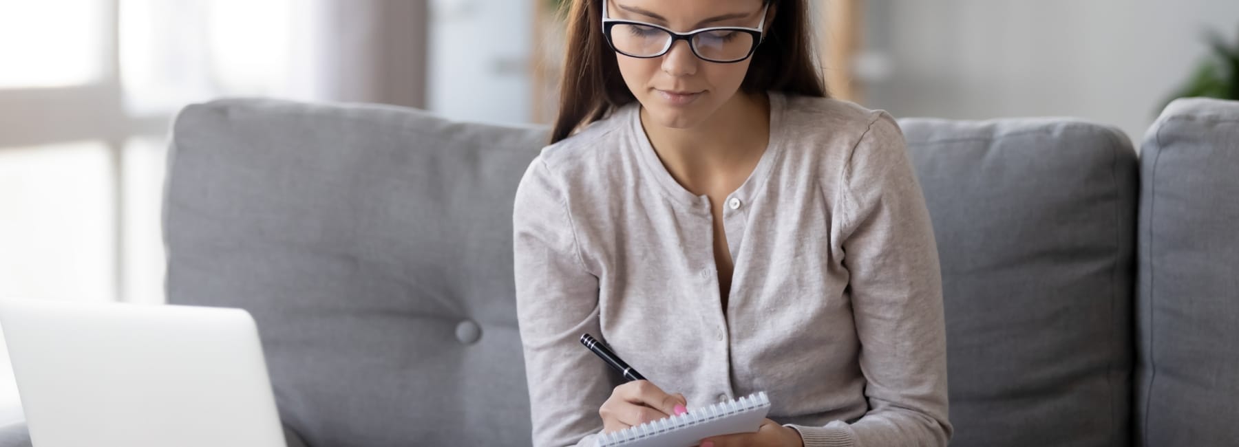 Young woman making a check list