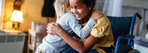 Child hugging another child