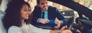 Woman with a car salesman