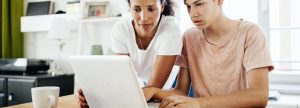 Mom and Son looking at a laptop