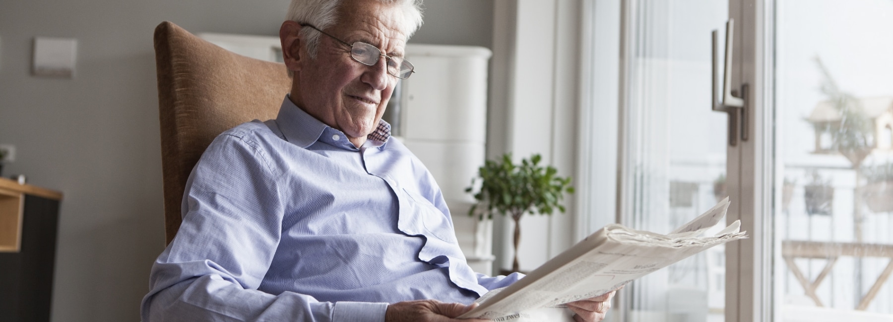 Old man reading the paper