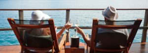 A couple relaxing on a dock
