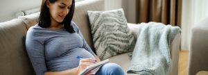Pregnant woman making a list