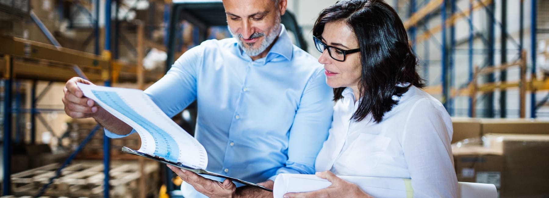 two people reading clipboard