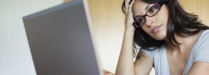 Woman looking at laptop