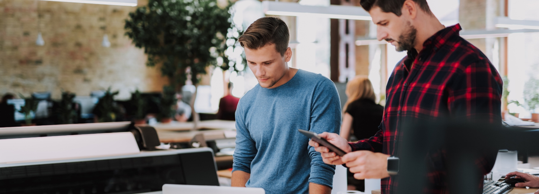 Two businessmen looking at a laptop screen