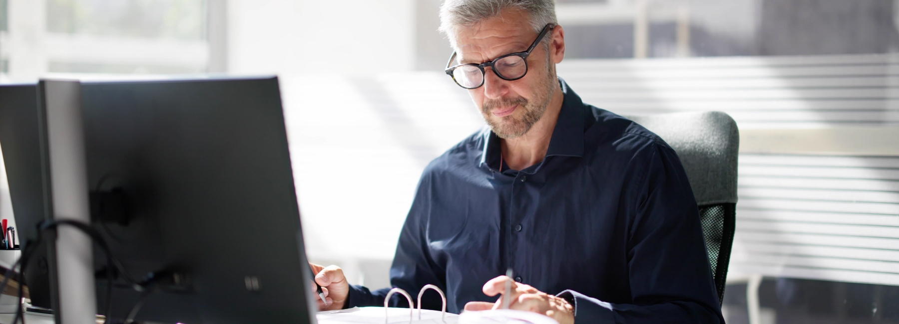 Man at desk doing his taxes